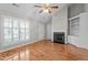 Cozy living room with hardwood floors, a fireplace, built-in shelves and natural light at 3782 Loblolly Dr # 5, Rocky Mount, NC 27804