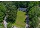 Aerial view of single Gathering home nestled amongst lush green trees at 40 Raccoon Xing, Henderson, NC 27537