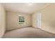 Bedroom featuring neutral walls, carpet flooring, and bright window at 40 Raccoon Xing, Henderson, NC 27537