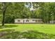 Beautiful home set on a large lot, surrounded by lush trees at 40 Raccoon Xing, Henderson, NC 27537