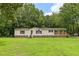 Inviting home featuring a well-maintained lawn and classic exterior details and colors at 40 Raccoon Xing, Henderson, NC 27537