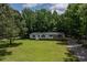 Charming single-story home with a well-manicured front lawn at 40 Raccoon Xing, Henderson, NC 27537