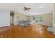 Comfortable living room with laminate flooring, sofa, and natural light, perfect for relaxation at 40 Raccoon Xing, Henderson, NC 27537