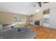 Open living room with fireplace, cabinets, and large windows, providing ample space and light at 40 Raccoon Xing, Henderson, NC 27537