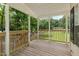 Inviting covered front porch offers the perfect spot to unwind and enjoy nature at 40 Raccoon Xing, Henderson, NC 27537
