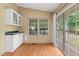 Sunny sunroom featuring sliding glass doors and built-in cabinets, ideal for relaxation at 40 Raccoon Xing, Henderson, NC 27537