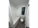 Bathroom features a bathtub and shower and window at 4025 Royal Dr, Franklinton, NC 27525