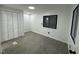 Bedroom boasts gray wood flooring, white walls, and a closet with bright lighting at 4025 Royal Dr, Franklinton, NC 27525