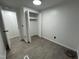 Bedroom featuring laminate flooring, an open closet and white walls at 4025 Royal Dr, Franklinton, NC 27525
