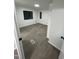 Bright bedroom featuring gray flooring, white walls, and trim, enhanced by natural light through the windows at 4025 Royal Dr, Franklinton, NC 27525