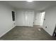 Inviting bedroom with gray flooring, white walls, and a closet with bifold door at 4025 Royal Dr, Franklinton, NC 27525