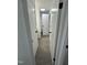 Hallway with gray wood flooring and white doors on both sides at 4025 Royal Dr, Franklinton, NC 27525