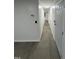 Hallway with laminate flooring and access to other rooms at 4025 Royal Dr, Franklinton, NC 27525