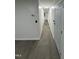 Hallway with wood laminate flooring and a light fixture on the ceiling at 4025 Royal Dr, Franklinton, NC 27525