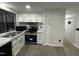 Bright kitchen with white cabinets, marble countertops, and stainless steel appliances at 4025 Royal Dr, Franklinton, NC 27525