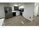 Newly renovated kitchen features white cabinets, grey countertops, and stainless steel appliances at 4025 Royal Dr, Franklinton, NC 27525