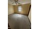 Bedroom with carpet, a window with blinds, and a ceiling fan with lights at 410 Carmil Dr, Selma, NC 27576
