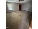 Spacious carpeted living room with a ceiling fan and window for natural light at 410 Carmil Dr, Selma, NC 27576