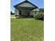 Rear of home features a covered area perfect for outdoor living at 410 Carmil Dr, Selma, NC 27576