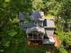 An aerial view showing the home has a porch and deck at 4117 Olde Coach Rd, Durham, NC 27707