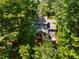 An aerial view shows the home has a screened porch and a deck at 4117 Olde Coach Rd, Durham, NC 27707