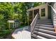 Backyard area with deck, porch, and storage shed at 4117 Olde Coach Rd, Durham, NC 27707