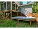 Backyard view of the elevated deck and stairway at 4117 Olde Coach Rd, Durham, NC 27707