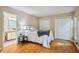 Bedroom with hardwood floors, closet and bathroom access at 4117 Olde Coach Rd, Durham, NC 27707