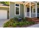 Charming home with garden bed and front porch at 4117 Olde Coach Rd, Durham, NC 27707