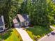 Charming single-Gathering home with a long driveway and mature trees in a lush neighborhood at 4117 Olde Coach Rd, Durham, NC 27707