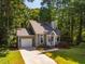 Charming single-Gathering home with a long driveway and mature trees in a lush neighborhood at 4117 Olde Coach Rd, Durham, NC 27707