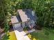 Charming single-Gathering home with a long driveway and mature trees in a lush neighborhood at 4117 Olde Coach Rd, Durham, NC 27707