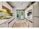 Functional kitchen with stainless steel appliances, white cabinets and ample counter space at 4117 Olde Coach Rd, Durham, NC 27707
