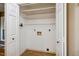 Spacious laundry room closet with white shelving at 4117 Olde Coach Rd, Durham, NC 27707
