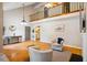Bright living room featuring a fireplace, high ceilings, large windows, and hardwood floors at 4117 Olde Coach Rd, Durham, NC 27707