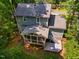 Charming home featuring a screened-in porch, deck, and a lush, wooded surrounding at 4117 Olde Coach Rd, Durham, NC 27707