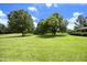 Backyard with a pond and mature trees creating a peaceful outdoor space at 4345 Mcintyre Rd, Gibsonville, NC 27249