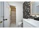 Bathroom featuring stylish wallpaper, a modern sink and vanity, and a separate shower area at 4345 Mcintyre Rd, Gibsonville, NC 27249