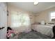 Cozy bedroom featuring soft natural light, comfortable bedding, and a charming rug for a tranquil atmosphere at 4345 Mcintyre Rd, Gibsonville, NC 27249