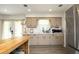 Updated kitchen with modern appliances, stylish cabinetry, and a view of the backyard, blending functionality with charm at 4345 Mcintyre Rd, Gibsonville, NC 27249