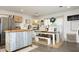Inviting kitchen and dining area featuring decorative touches, a stainless steel refrigerator, and ample natural light at 4345 Mcintyre Rd, Gibsonville, NC 27249