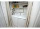 Laundry room featuring a washer and dryer, storage shelves, and neutral decor for functionality and style at 4345 Mcintyre Rd, Gibsonville, NC 27249
