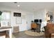 Cozy living room with unique decor, featuring a home office setup with modern monitors and comfortable furniture at 4345 Mcintyre Rd, Gibsonville, NC 27249