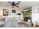 Warm living room featuring a brick fireplace, cozy seating, and rustic decor, creating an inviting and comfortable atmosphere at 4345 Mcintyre Rd, Gibsonville, NC 27249