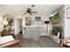 Comfortable living room with a brick fireplace, ceiling fan, and cozy decor, ideal for relaxation and entertainment at 4345 Mcintyre Rd, Gibsonville, NC 27249
