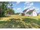 Expansive backyard, lined with trees, offering plenty of room for recreation and enjoying nature at 454 Martins Mill Ct, Wendell, NC 27591