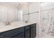Bathroom features a double sink vanity, and an open doorway to the shower at 454 Martins Mill Ct, Wendell, NC 27591