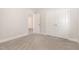 Neutral carpeted bedroom featuring double closets and an open doorway at 454 Martins Mill Ct, Wendell, NC 27591