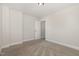 Neutral bedroom featuring neutral carpet and walls, and a walk-in closet at 454 Martins Mill Ct, Wendell, NC 27591