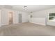Spacious bonus room with a view to the outdoors and an open doorway to another space at 454 Martins Mill Ct, Wendell, NC 27591